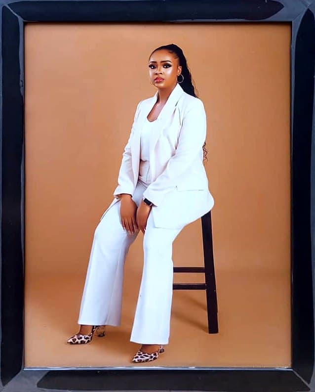 Studio portrait, white suit, 10×12 in black frame